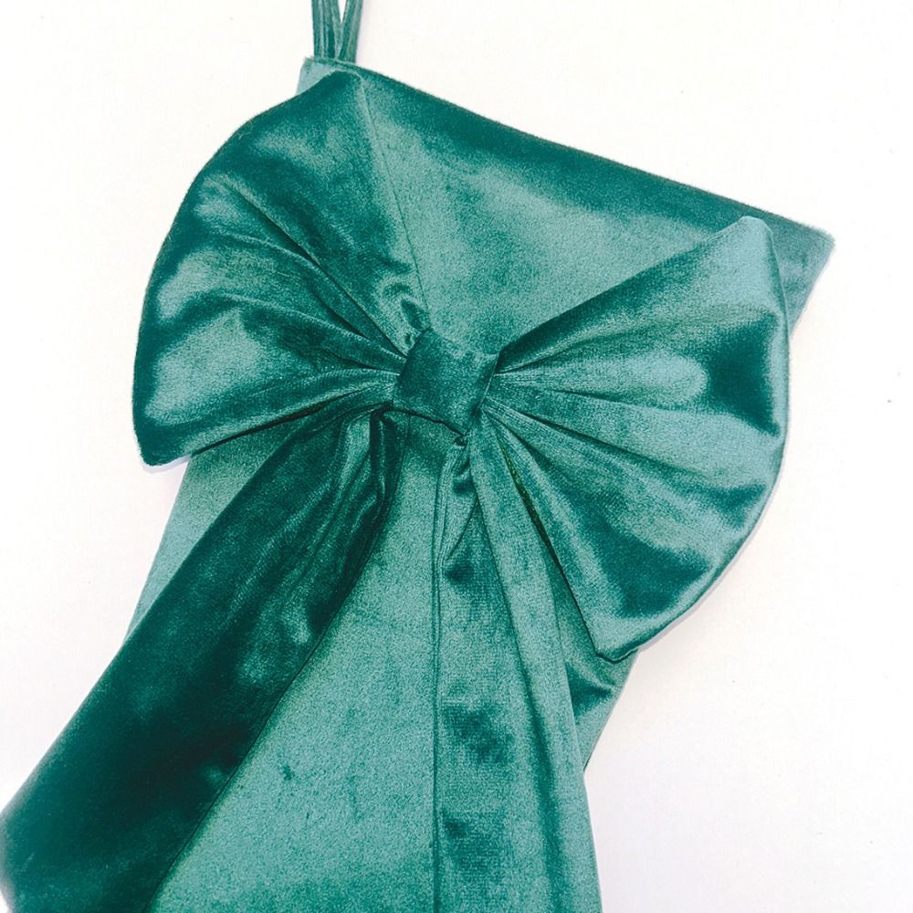 جوارب عيد الميلاد بتصميم عقدة  - مراجعة Christmas Stocking Hanging وسعره